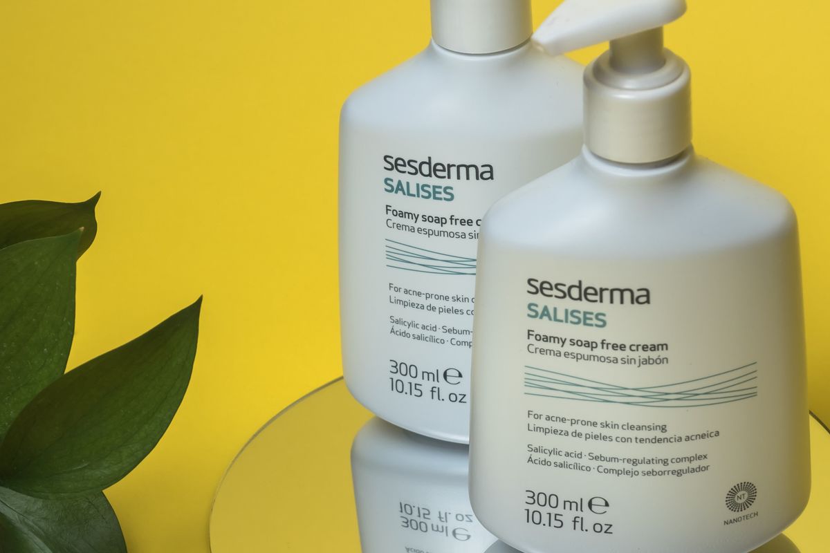 Skincare bottles arranged on a bathroom shelf